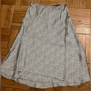 Small black and white patterned silky midi skirt